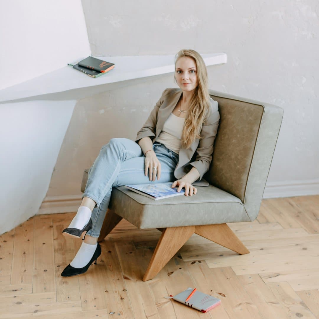Anna Daccache sitting in an armchair
